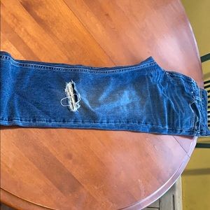 Blue jeans with rips on leg